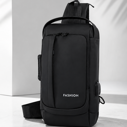Black sling bag with 'FASHION' label on a light background